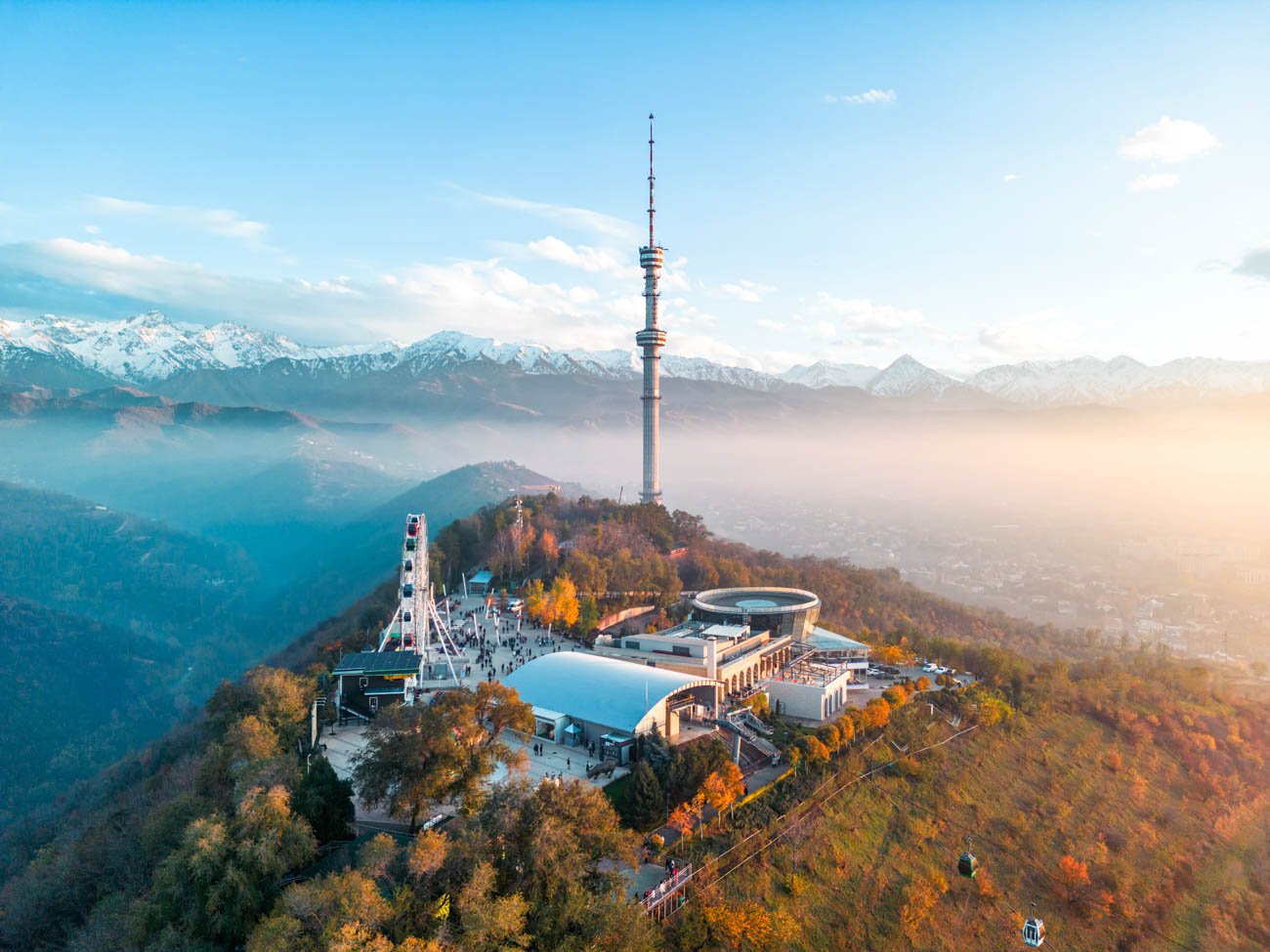 Aerial view of Kok-Tobe hill with Television Tower and amusement park in Almaty city